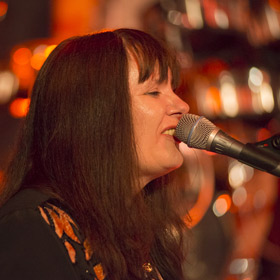 Chelle Free playing Maracas